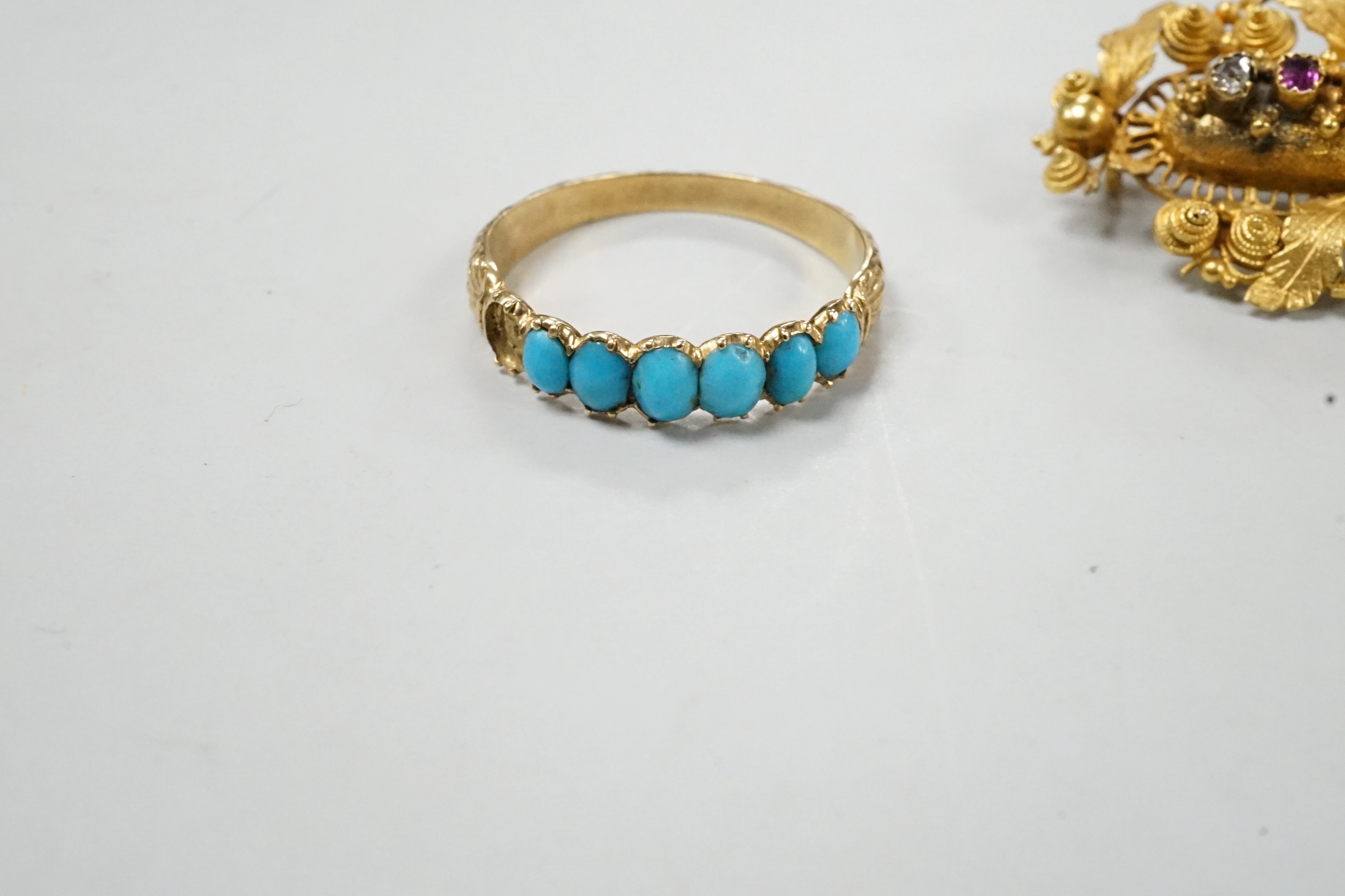 A Victorian yellow metal and gem set 'Regard' brooch, 36mm and a yellow metal and turquoise set half hoop ring (stone missing), gross weight 6.1 grams.